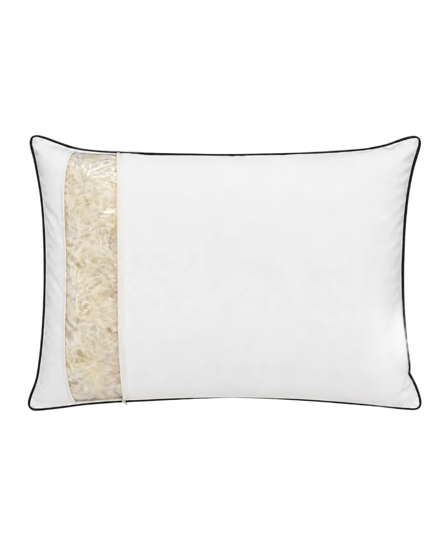 White pillow with feather on a white background