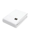 White wallet with a brand logo on a light gray background