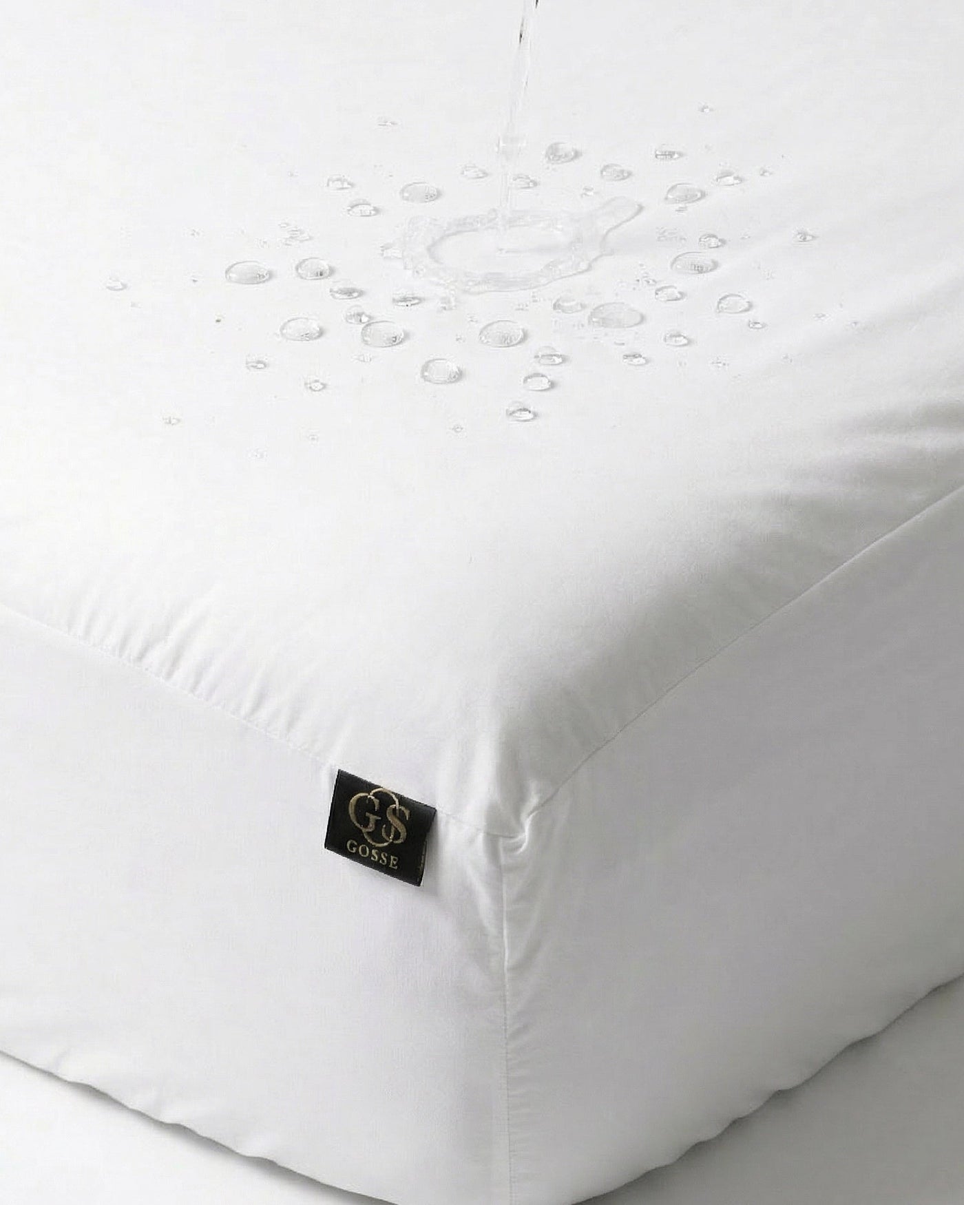 White mattress cover with a brand logo on a white background